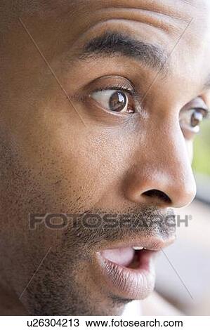 Stock Image - Head shot of surprised man. Fotosearch
