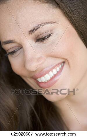 Stock Photo - Head shot of woman smiling. Fotosearch