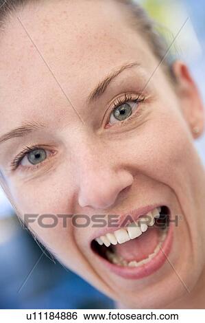 Stock Photograph - Head shot of woman smiling. Fotosearch