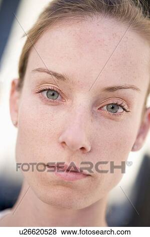 Stock Photo - Head shot of woman thinking. Fotosearch