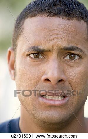 Head shot of man scowling View Large Photo Image Stock Image - Head shot of man scowling. Fotosearch