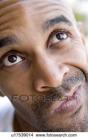 Head shot of man thinking View Large Photo Image Picture - Head shot of man thinking. Fotosearch