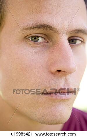 Stock Image - Head shot of man thinking. Fotosearch