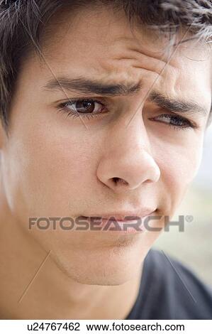 Stock Image - Head shot of man worried. Fotosearch