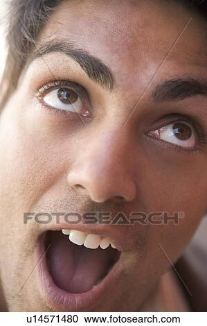 Stock Image - Head shot of surprised man. Fotosearch