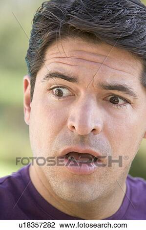 Stock Image - Head shot of surprised man. Fotosearch