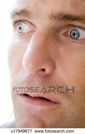 Stock Photo - Head shot of surprised man. Fotosearch