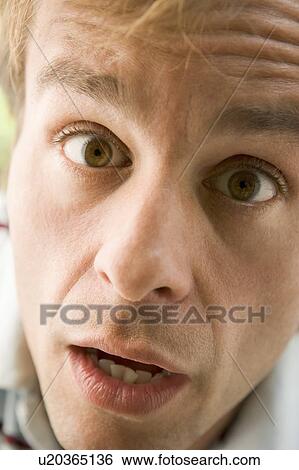 Stock Photograph - Head shot of surprised man. Fotosearch