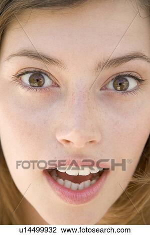 Stock Image - Head shot of surprised woman. Fotosearch