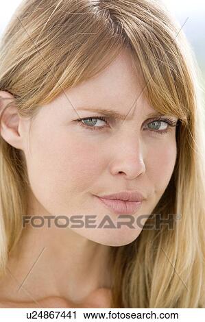 Head shot of woman scowling View Large Photo Image Stock Image - Head shot of woman scowling. Fotosearch