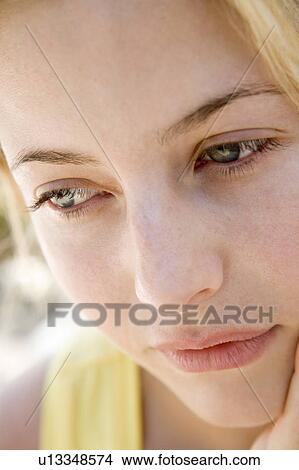 Picture - Head shot of woman thinking. Fotosearch