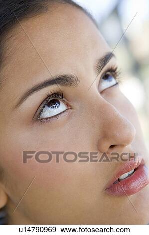 Stock Photo - Head shot of woman thinking. Fotosearch