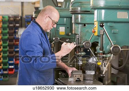 Machinist working on machine View Large Photo Image Stock Image - Machinist working on machine. Fotosearch