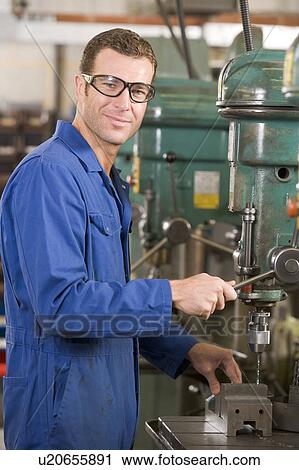 Machinist working on machine View Large Photo Image Stock Image - Machinist working on machine. Fotosearch
