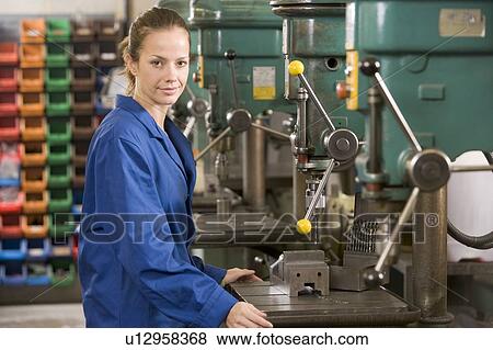 Machinist working on machine View Large Photo Image Stock Photo - Machinist working on machine. Fotosearch