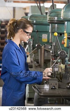 Machinist working on machine View Large Photo Image Stock Photo - Machinist working on machine. Fotosearch