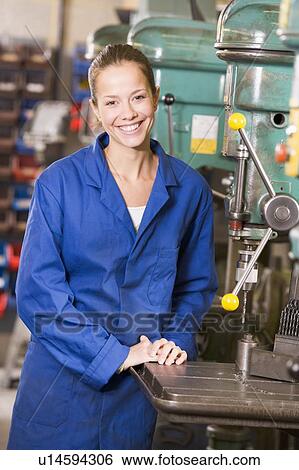Stock Photograph - Machinist working on machine. Fotosearch
