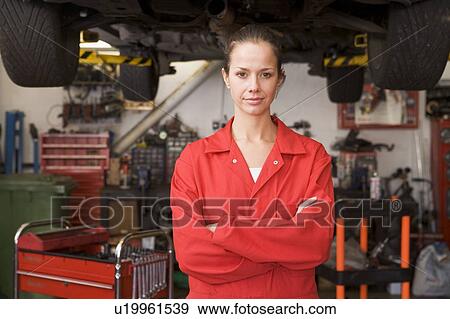 Mechanic standing in garage View Large Photo Image Stock Photo - Mechanic standing in garage. Fotosearch
