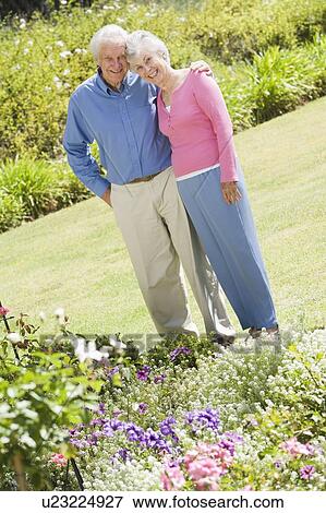 Senior couple in a flower garden View Large Photo Image Stock Photo - Senior couple in a flower garden. Fotosearch