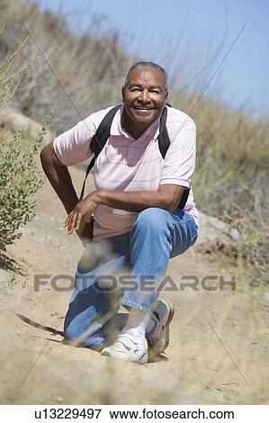 Senior man on a walking trail View Large Photo Image Stock Photo - Senior man on a walking trail. Fotosearch