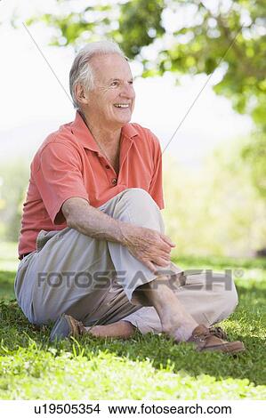 Picture - Senior man sitting outdoors. Fotosearch
