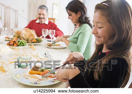 Picture - Family All Together At Christmas Dinner. Fotosearch