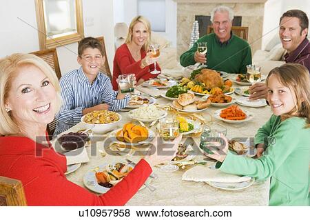Stock Photo - Family All Together At Christmas Dinner. Fotosearch