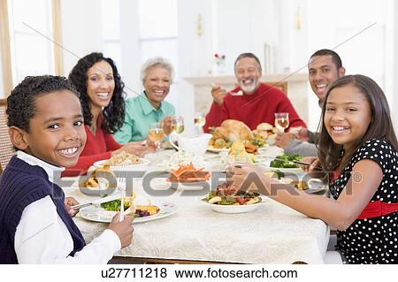 Stock Photo - Family All Together At Christmas Dinner. Fotosearch