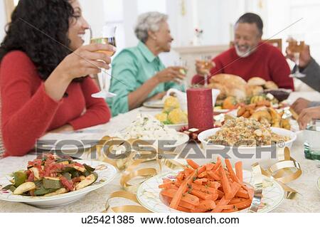 Family All Together At Christmas Dinner View Large Photo Image Stock Photography - Family All Together At Christmas Dinner. Fotosearch