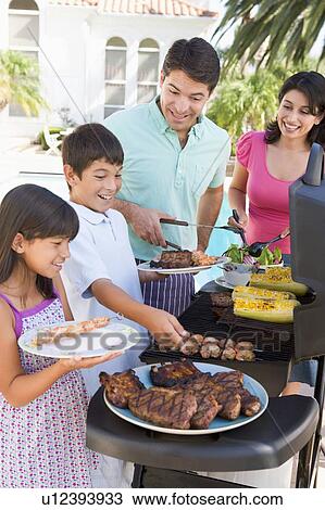 Family Enjoying A Barbeque View Large Photo Image Stock Image - Family Enjoying A Barbeque. Fotosearch