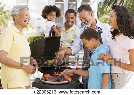 Family Enjoying A Barbeque View Large Photo Image Stock Image - Family Enjoying A Barbeque. Fotosearch