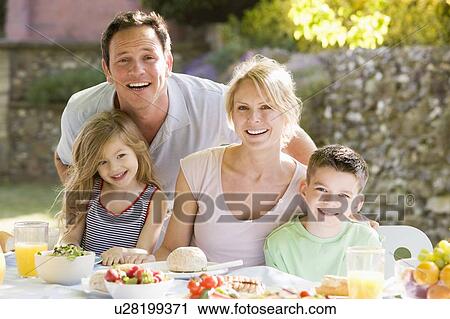 Family Enjoying A Barbeque View Large Photo Image Stock Image - Family Enjoying A Barbeque. Fotosearch