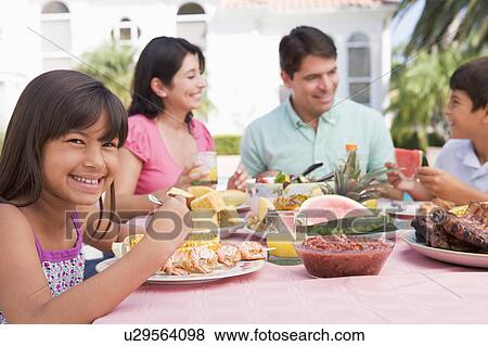 Family Enjoying A Barbeque View Large Photo Image Stock Photo - Family Enjoying A Barbeque. Fotosearch