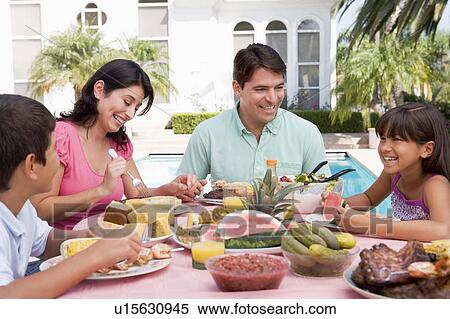 Family Enjoying A Barbeque View Large Photo Image Stock Photography - Family Enjoying A Barbeque. Fotosearch