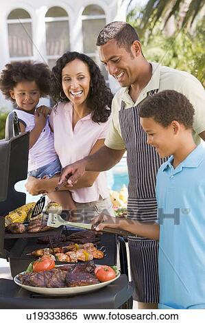 Family Enjoying A Barbeque View Large Photo Image Stock Photography - Family Enjoying A Barbeque. Fotosearch