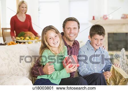Stock Image - Portrait Of Family At Christmas. Fotosearch