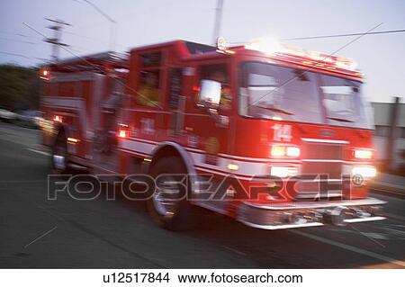 Fire engine on street (blur) View Large Photo Image Picture - Fire engine on street (blur). Fotosearch