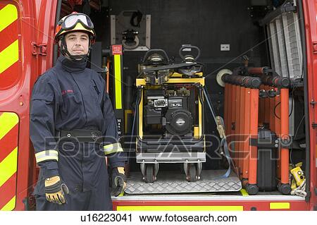 Rescue worker standing by open back door of rescue vehicle View Large Photo Image Stock Image - Rescue worker standing by open back door of rescue vehicle. Fotosearch