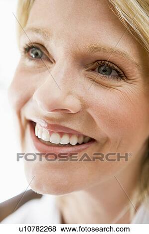 Stock Photo - Head shot of woman smiling. Fotosearch
