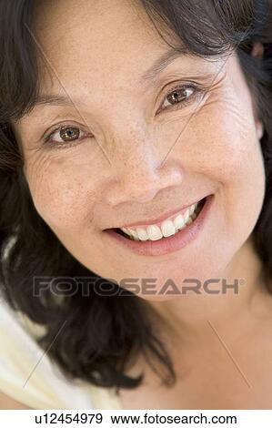 Head shot of woman smiling View Large Photo Image Stock Photo - Head shot of woman smiling. Fotosearch