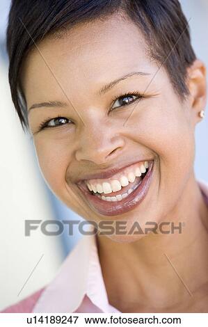 Head shot of woman smiling View Large Photo Image Stock Photo - Head shot of woman smiling. Fotosearch