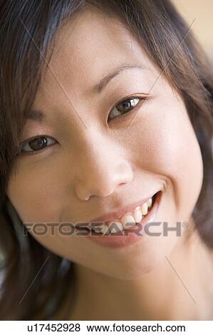 Stock Photo - Head shot of woman smiling. Fotosearch