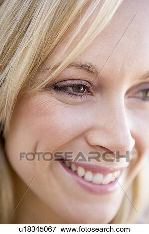 Stock Photo - Head shot of woman smiling. Fotosearch
