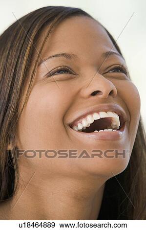 Stock Photo - Head shot of woman smiling. Fotosearch
