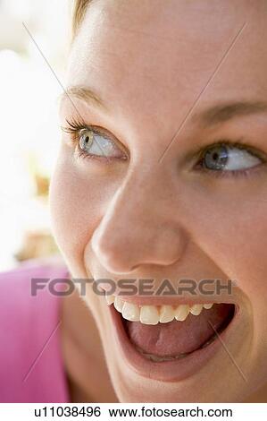Stock Photograph - Head shot of woman smiling. Fotosearch