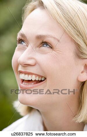 Stock Photography - Head shot of woman smiling. Fotosearch
