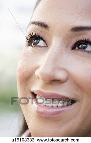 Woman's smiling face outdoors (selective focus) View Large Photo Image Stock Image - Woman's smiling face outdoors (selective focus). Fotosearch