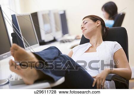 Woman in computer room sleeping View Large Photo Image Stock Photo - Woman in computer room sleeping. Fotosearch
