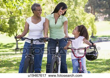 Grandmother mother and granddaughter bike riding. View Large Photo Image Stock Photo - Grandmother mother and granddaughter bike riding.. Fotosearch