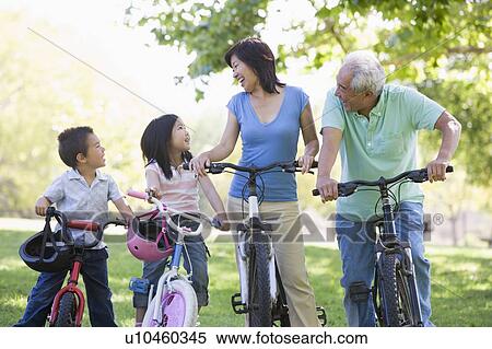 Grandparents bike riding with grandchildren. View Large Photo Image Stock Photography - Grandparents bike riding with grandchildren.. Fotosearch
